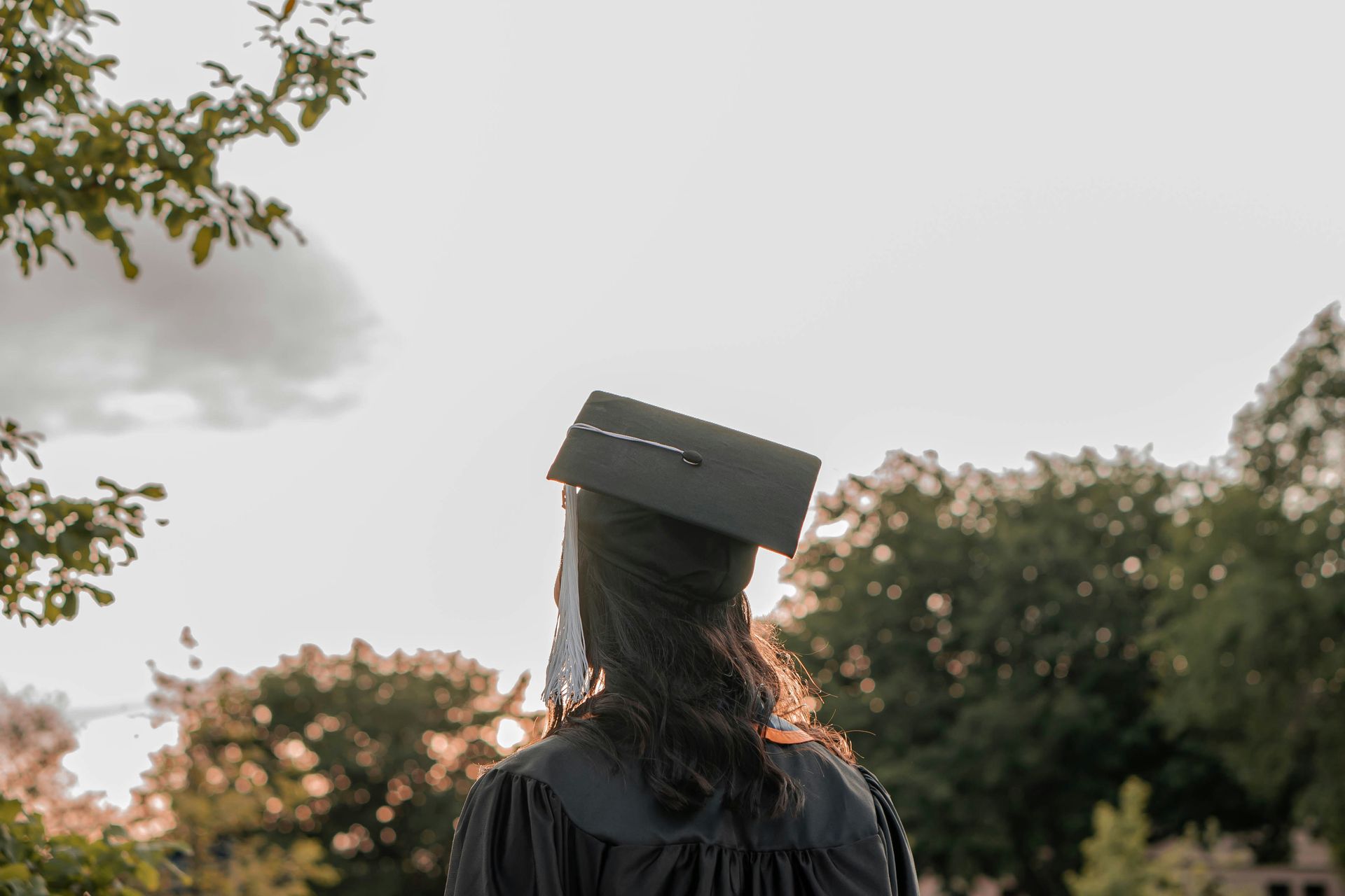 a woman wearing a graduation cap and gown